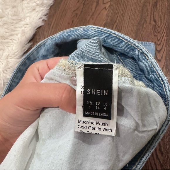 Light Wash Distressed Straight Leg Jean - Picture 4 of 5